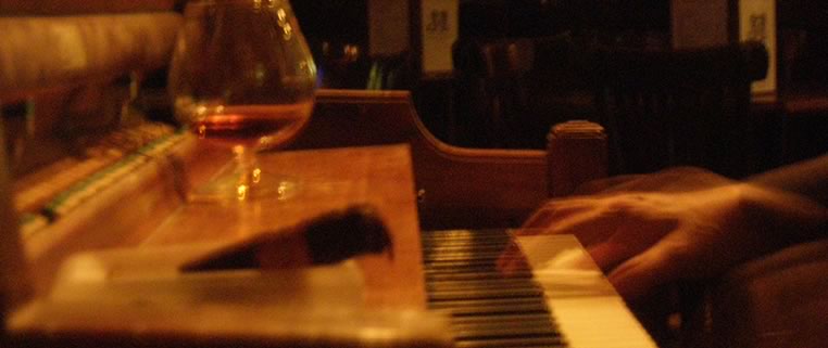 John Fohl, cigar and guitar at Dos Jefes Cigar Bar